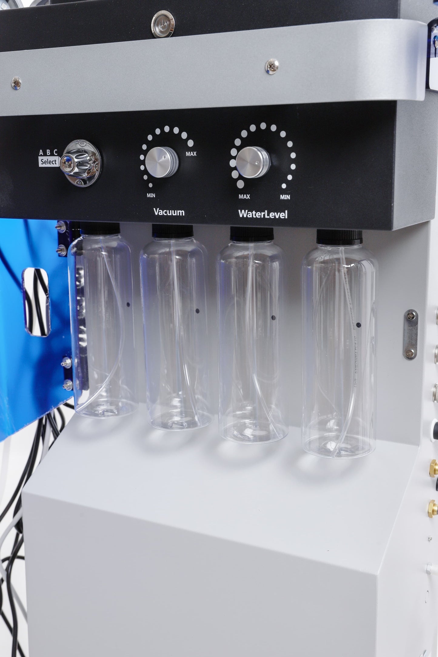 Hydra Smart Beauty machine fluid bottles and control panel with vacuum and water level adjustment dials