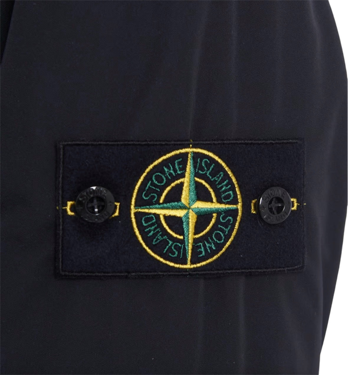 Men’s Stone Island hooded jacket with 100% recycled PrimaLoft® insulation for warmth and sustainability.