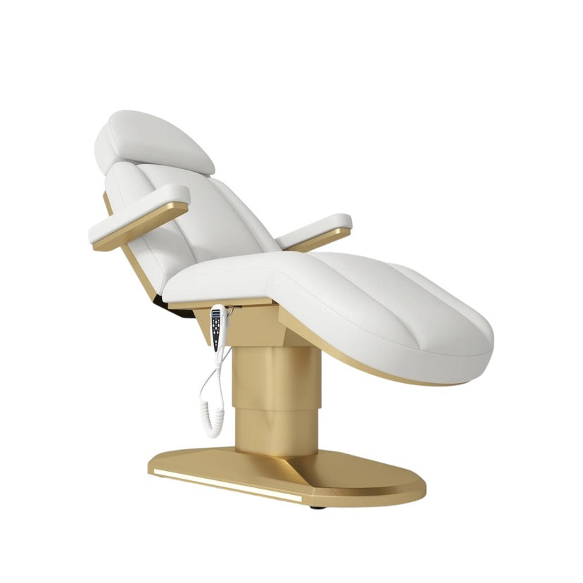 White and gold medical examination chair on a white background