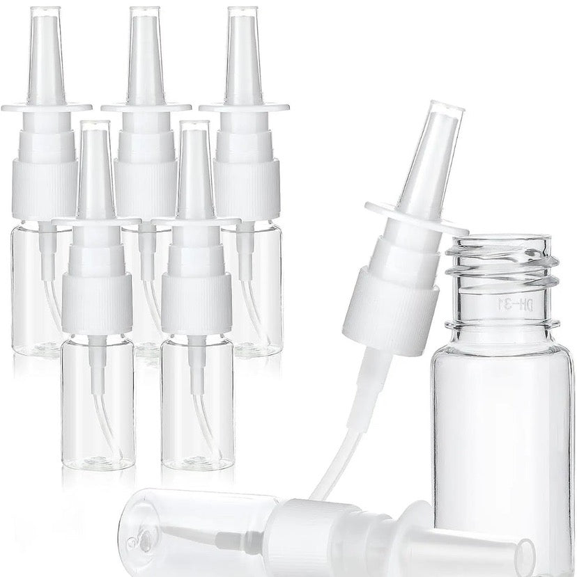Clear nasal spray bottles with white pumps, perfect for travel or daily wellness use.